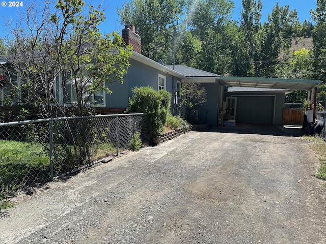 single story home featuring a carport