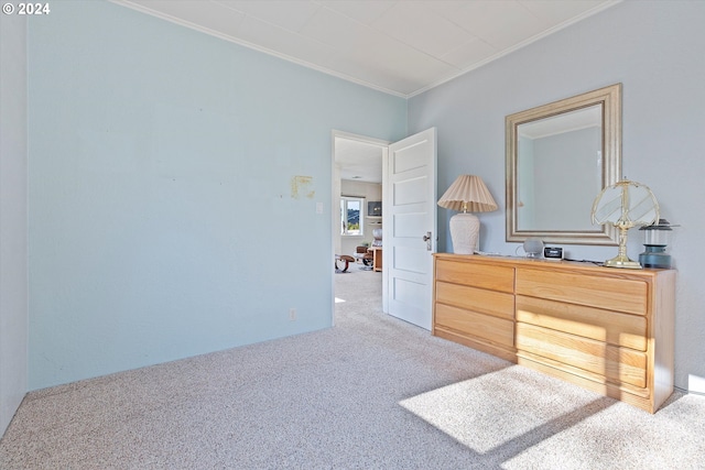 carpeted bedroom featuring ornamental molding