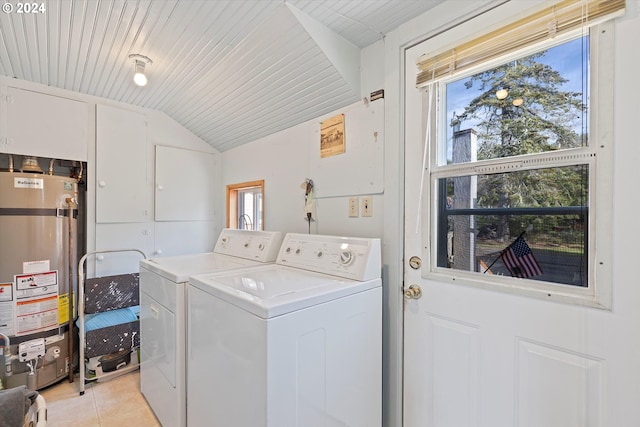 laundry room featuring independent washer and dryer, light tile patterned flooring, wood ceiling, and gas water heater