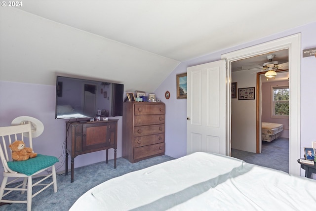 carpeted bedroom featuring lofted ceiling and ceiling fan