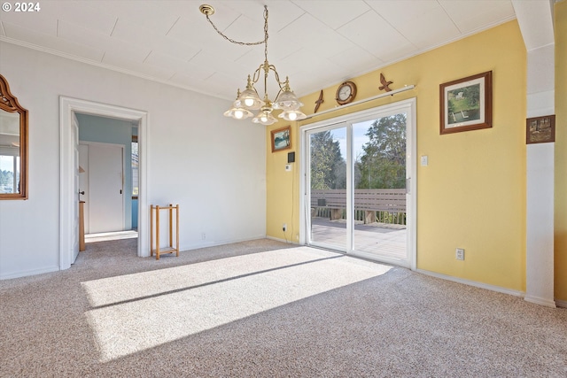 carpeted empty room with ornamental molding and an inviting chandelier