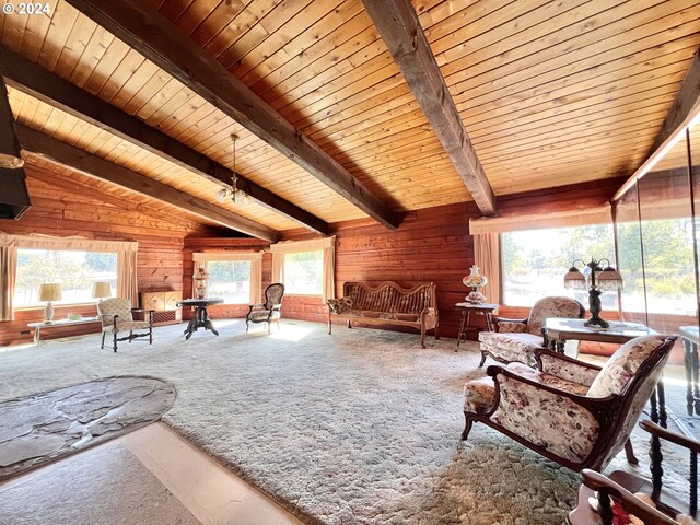 living room featuring carpet floors, vaulted ceiling with beams, wooden walls, and wood ceiling