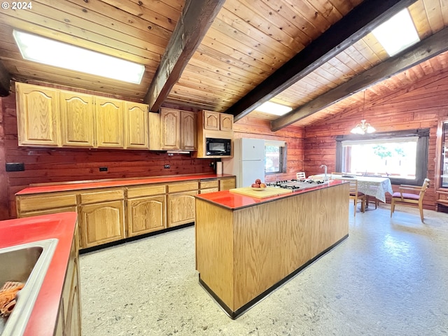530 Riverside Dr, Burns, OR 97720 - kitchen with white appliances, wood ceiling, wooden walls, a center island with sink, and a sink