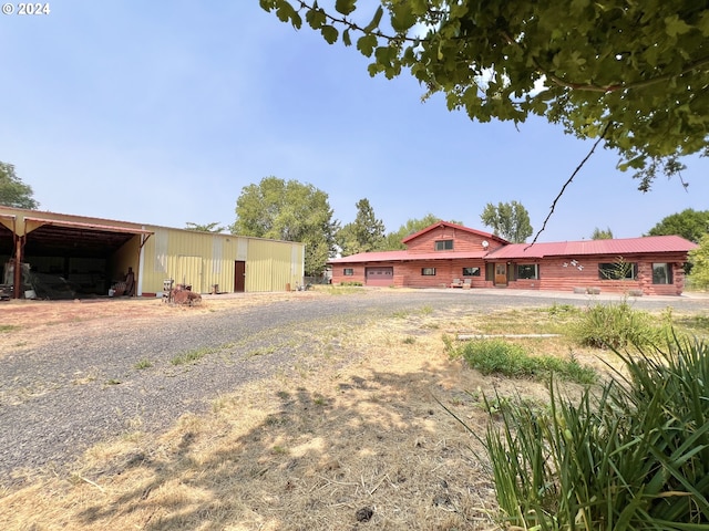 530 Riverside Dr, Burns, OR 97720 - back of house featuring a pole building and an outdoor structure