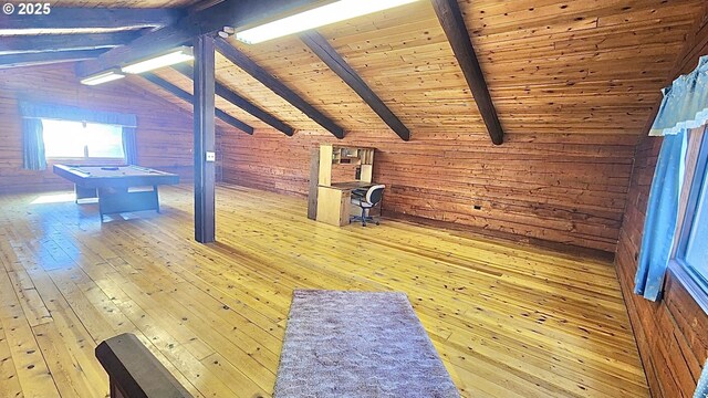 recreation room featuring lofted ceiling with beams, light wood-type flooring, wooden ceiling, and wooden walls