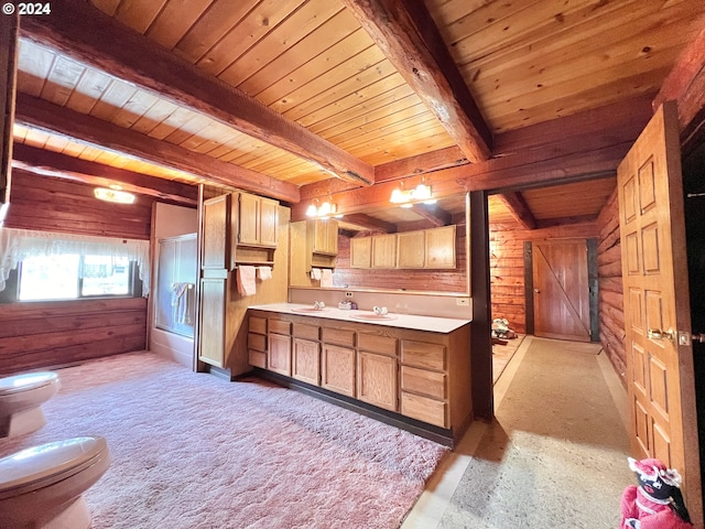 530 Riverside Dr, Burns, OR 97720 - kitchen with wooden ceiling with exposed beams, wood walls, a sink, light countertops, and light colored carpet