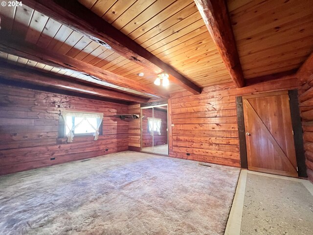 garage with wooden ceiling, a garage door opener, wooden walls, and white fridge