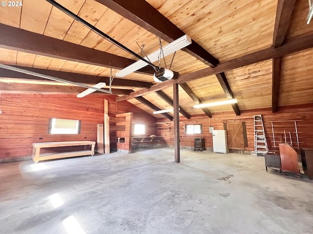 530 Riverside Dr, Burns, OR 97720 - miscellaneous room with wooden walls, wood ceiling, concrete flooring, and a garage