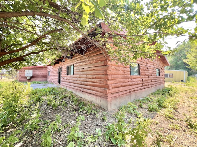 530 Riverside Dr, Burns, OR 97720 - view of home's exterior with log exterior and a patio area