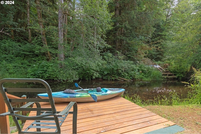 wooden terrace with a water view