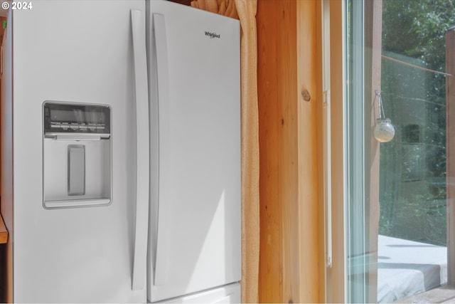 interior details featuring white refrigerator with ice dispenser