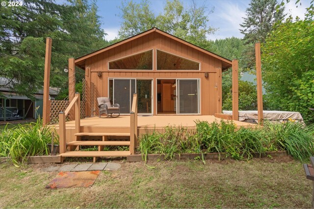 back of house featuring a wooden deck