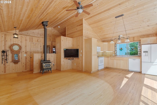 kitchen with pendant lighting, white appliances, light hardwood / wood-style flooring, wooden ceiling, and a wood stove