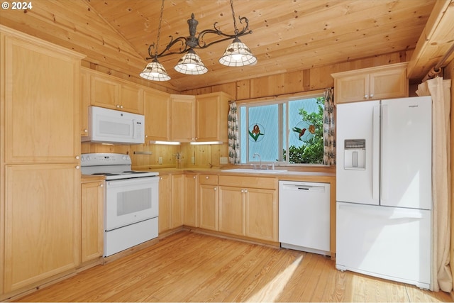 kitchen featuring white appliances, decorative light fixtures, light brown cabinetry, and sink