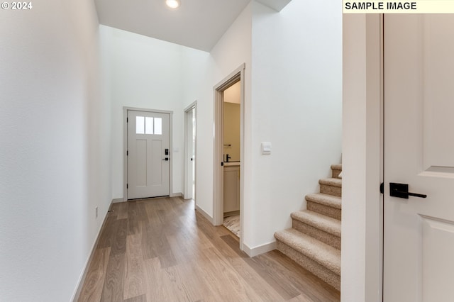 entrance foyer with light hardwood / wood-style flooring