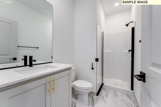 bathroom featuring vanity, toilet, and walk in shower