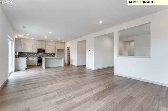 unfurnished living room featuring light hardwood / wood-style flooring