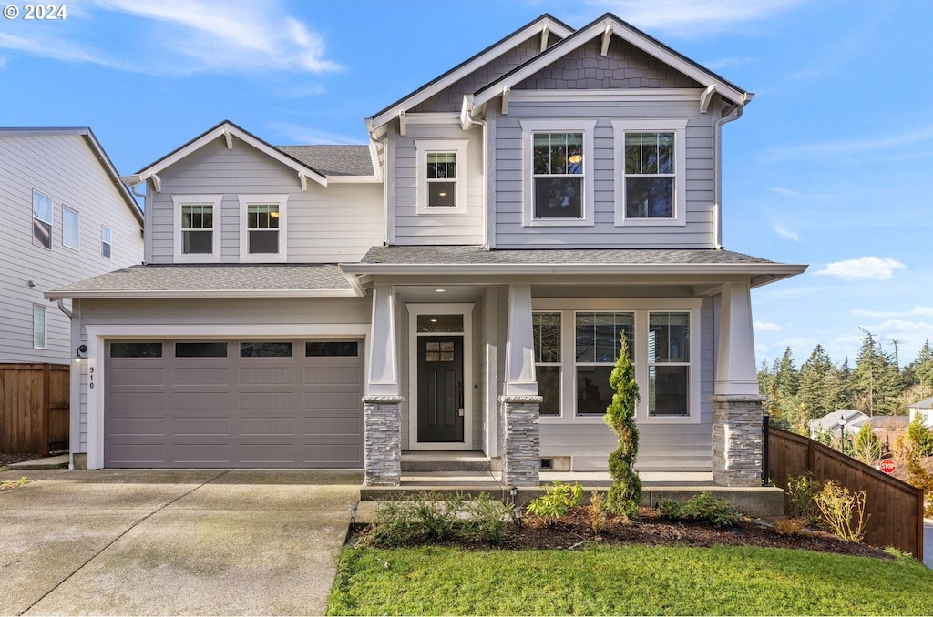 craftsman-style home with a garage and a porch