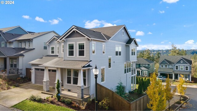 view of front of property with a garage and a porch