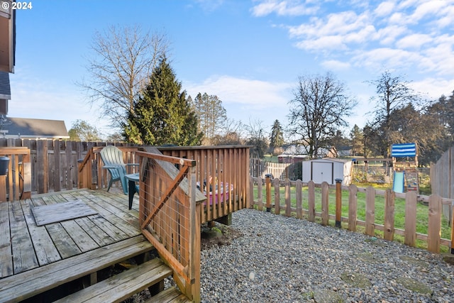 wooden terrace with a storage shed