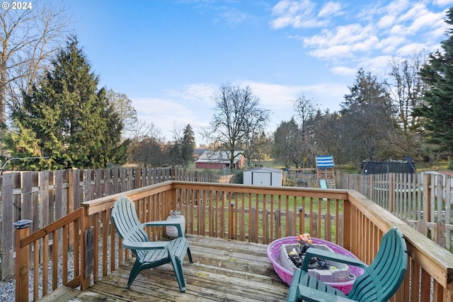 deck with a trampoline and a storage unit