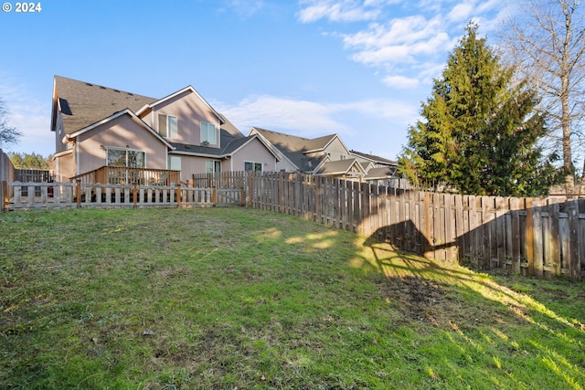 view of yard with a wooden deck