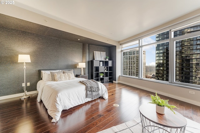 bedroom with hardwood / wood-style flooring