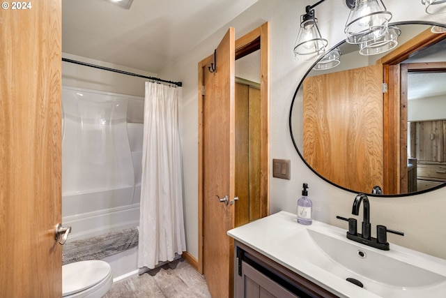 full bathroom with vanity, toilet, hardwood / wood-style floors, and shower / bath combo with shower curtain