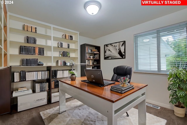 home office featuring visible vents and baseboards