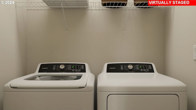 laundry area with independent washer and dryer