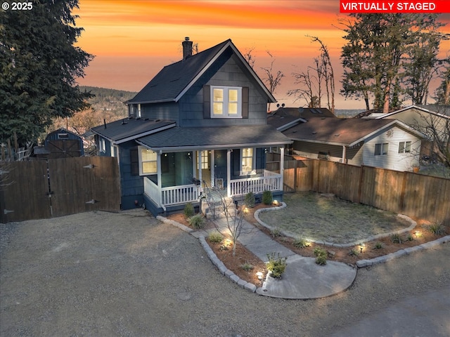 view of front of property featuring covered porch