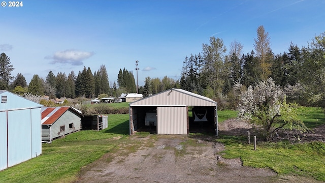 garage featuring a lawn