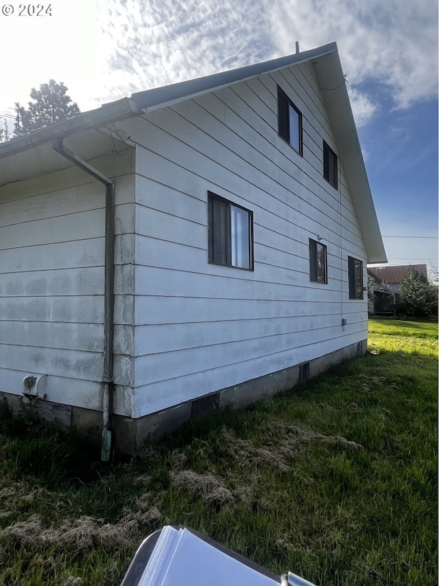 view of home's exterior featuring a lawn