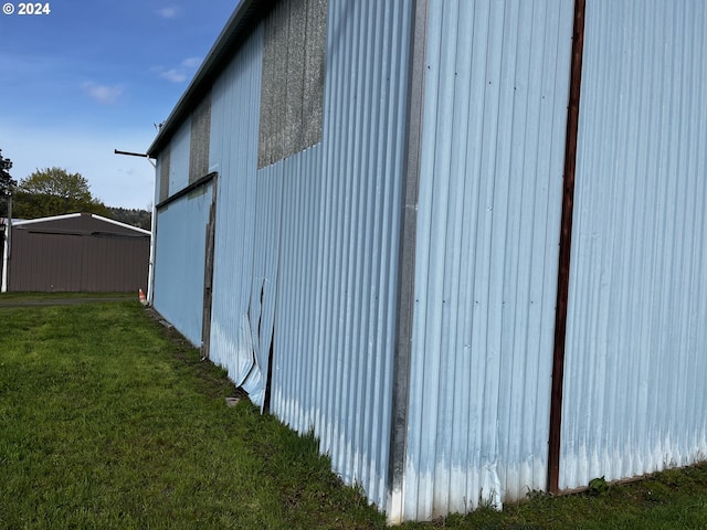 view of home's exterior with a yard