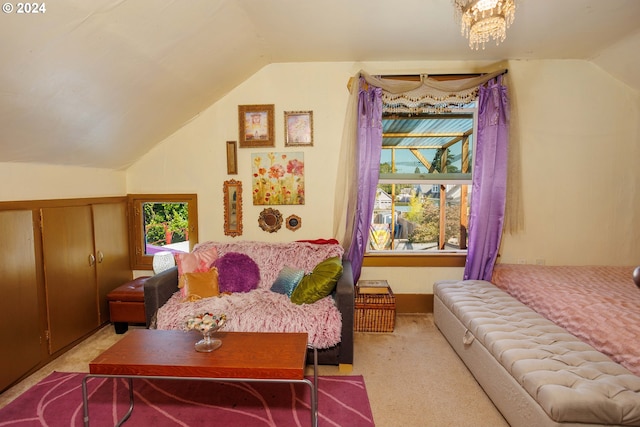 sitting room featuring vaulted ceiling, carpet, an inviting chandelier, and a healthy amount of sunlight