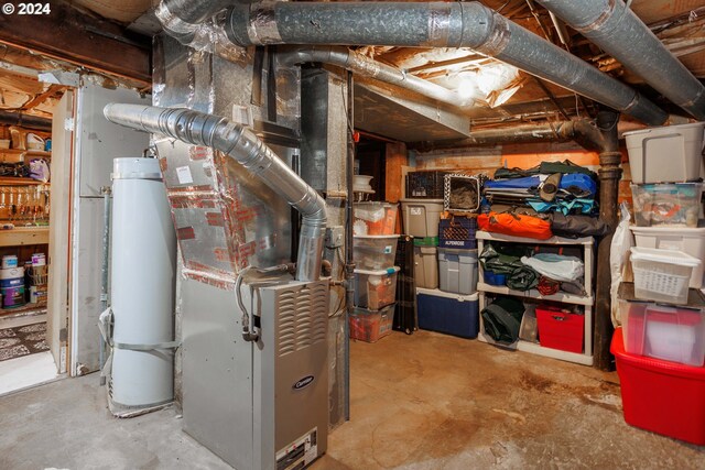 utility room with gas water heater