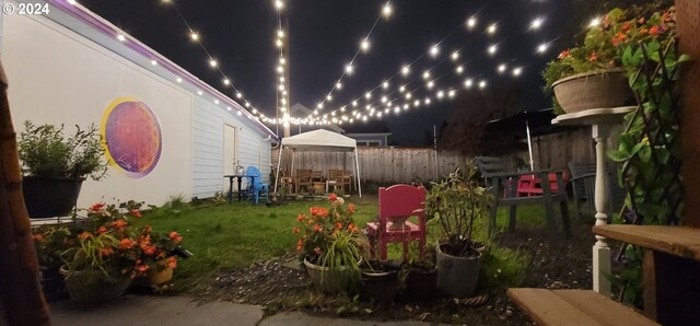 view of yard at twilight