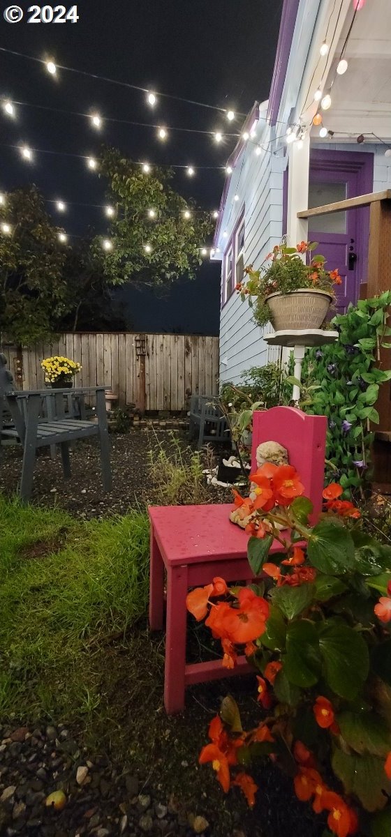 yard at night with fence