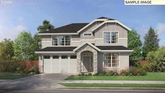 craftsman house with a front yard and a garage