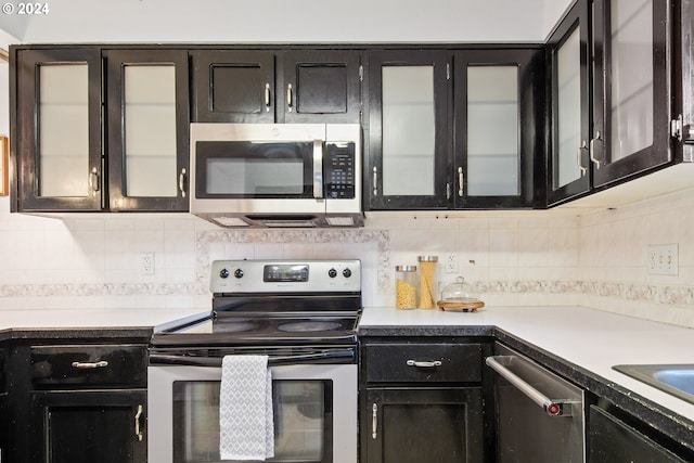 kitchen featuring decorative backsplash and stainless steel appliances