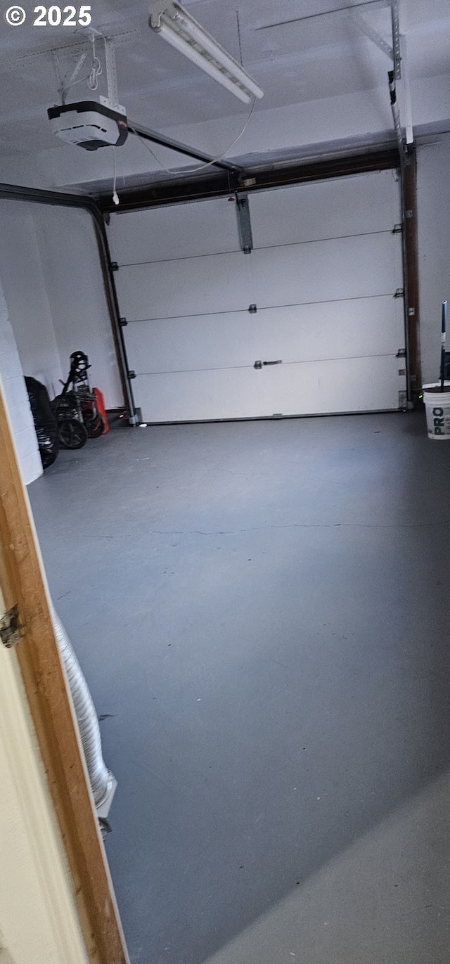 garage featuring a garage door opener