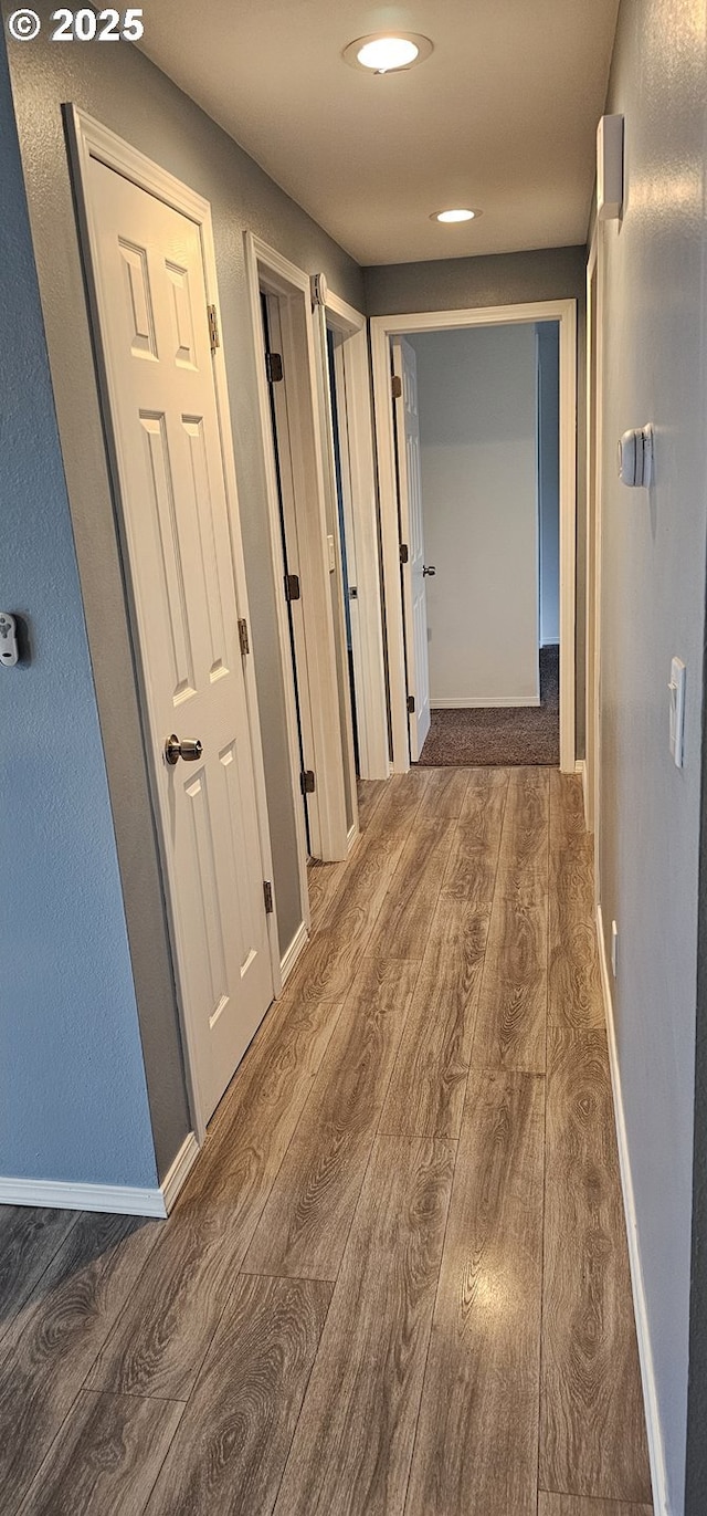 hall with dark hardwood / wood-style floors