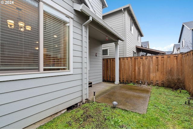 view of side of property featuring a patio area