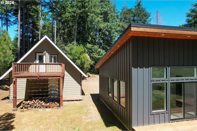 view of side of property featuring a deck