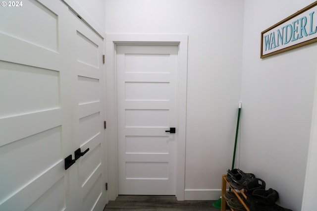 doorway to outside with dark hardwood / wood-style floors