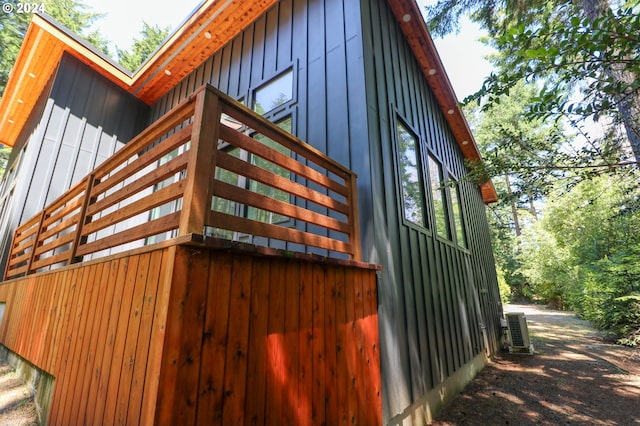 view of side of property with central air condition unit