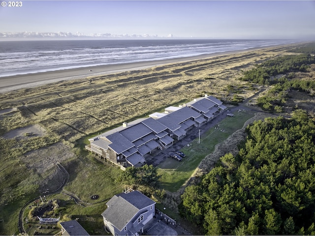 aerial view featuring a view of the beach and a water view