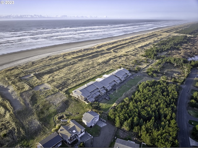 aerial view with a water view and a view of the beach