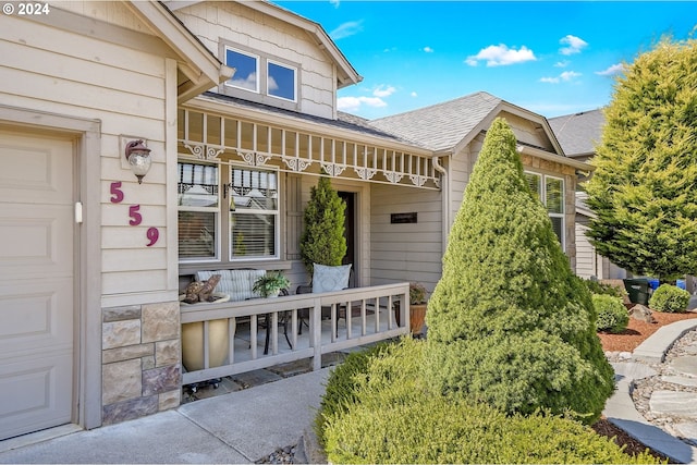 doorway to property with a garage