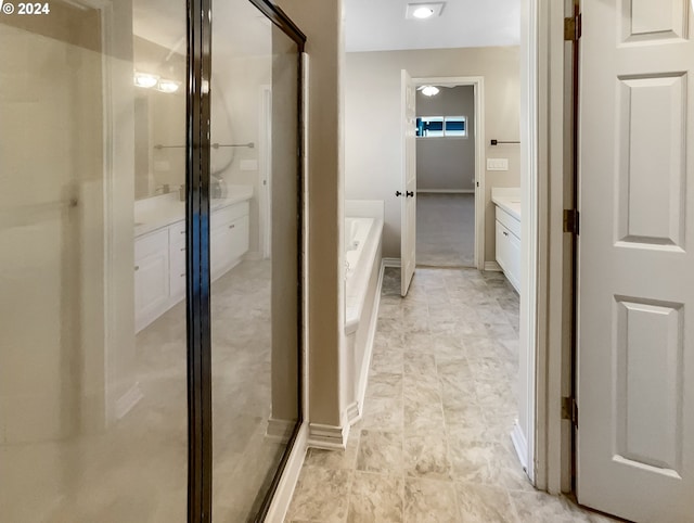 bathroom with vanity and plus walk in shower